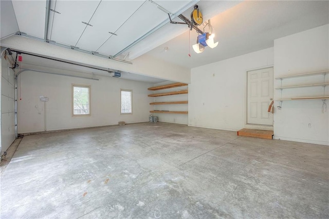 4411 N Mulberry Dr, Kansas City, MO 64116 - garage featuring a garage door opener