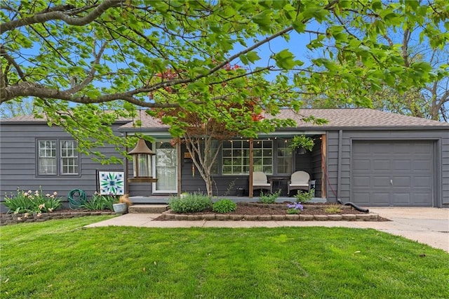 8334 Kenwood Ave, Kansas City, MO 64131 - view of front of house featuring a front yard, driveway, and a garage
