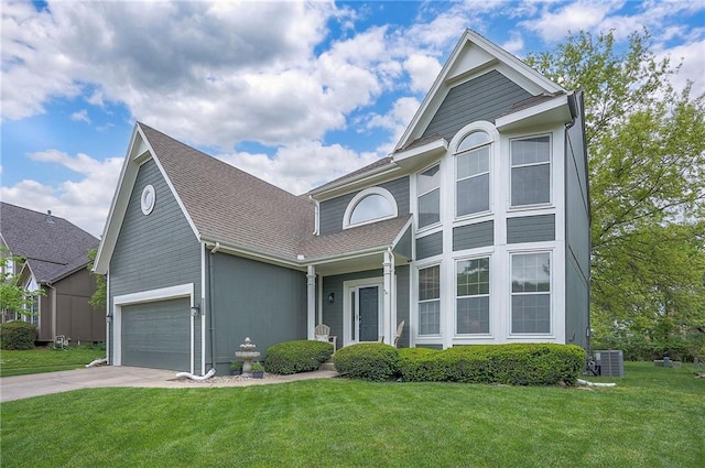 view of front of house with driveway, central AC unit, a shingled roof, and a front yard