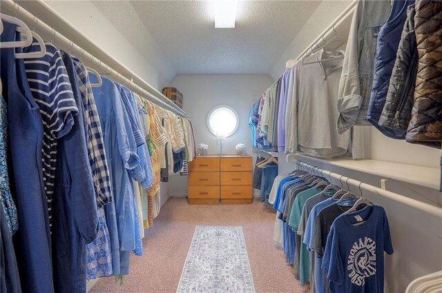 walk in closet featuring carpet