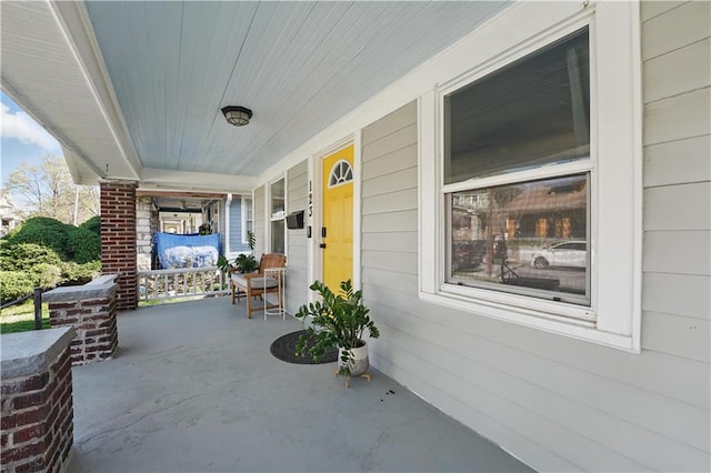 view of patio featuring a porch