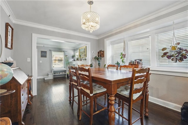 dining space featuring plenty of natural light, crown molding, and dark wood-style floors