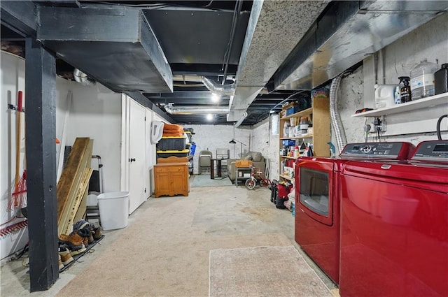 unfinished below grade area featuring washing machine and clothes dryer