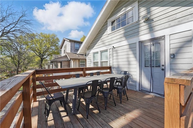 wooden terrace with outdoor dining space