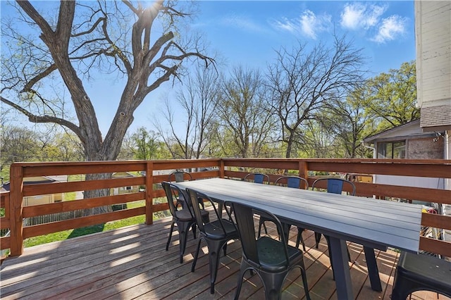 wooden terrace featuring outdoor dining space