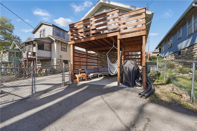 exterior space featuring a fenced backyard and a gate