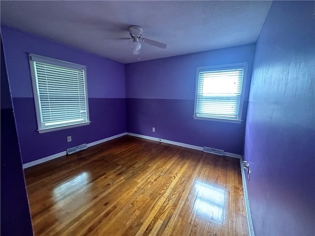 4322 Everett Ave, Kansas City, KS 66102 - empty room featuring wood finished floors, a ceiling fan, and baseboards