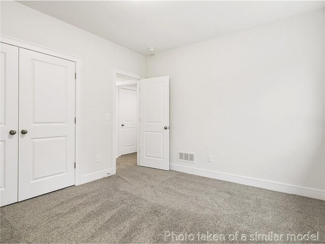 11600 S Millridge St, Olathe, KS 66061 - unfurnished bedroom with carpet floors, baseboards, and a closet
