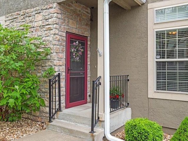 11179 S Summit St, Olathe, KS 66062 - property entrance with stucco siding and stone siding