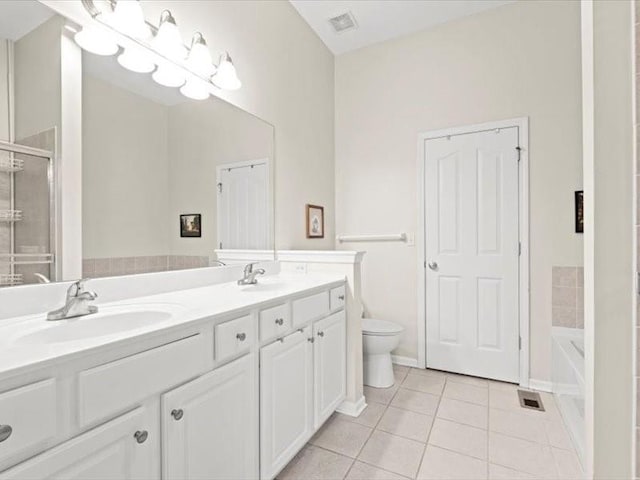11179 S Summit St, Olathe, KS 66062 - bathroom with a sink, tile patterned flooring, double vanity, toilet, and a stall shower
