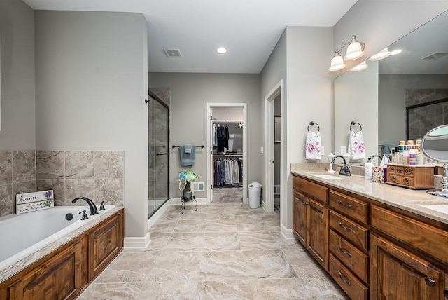 full bath featuring visible vents, a garden tub, double vanity, a shower stall, and a sink