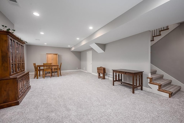 living area with stairs, recessed lighting, light colored carpet, and visible vents