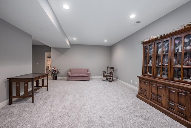 sitting room featuring baseboards, carpet flooring, and recessed lighting