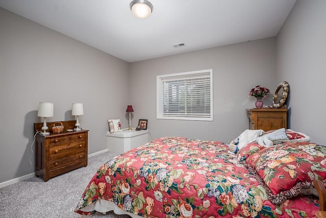 bedroom featuring carpet floors, baseboards, and visible vents