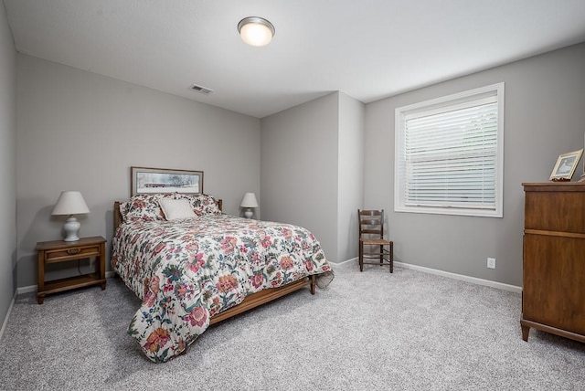 bedroom featuring carpet floors, baseboards, and visible vents