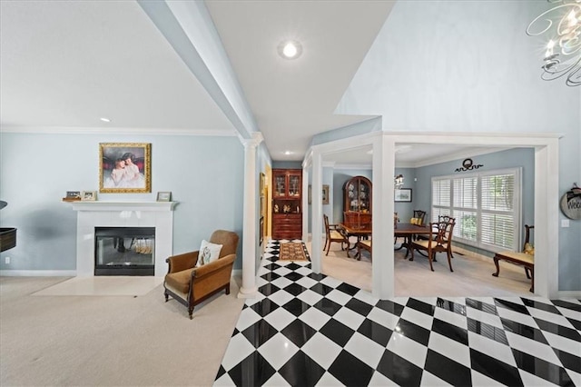26266 W 110th Ter, Olathe, KS 66061 - living area with ornate columns, crown molding, a fireplace with flush hearth, recessed lighting, and a chandelier