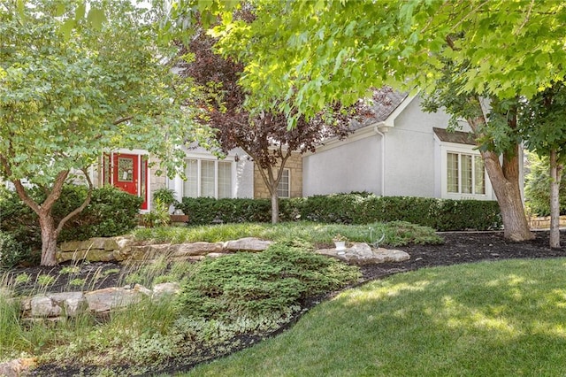 26266 W 110th Ter, Olathe, KS 66061 - view of property hidden behind natural elements featuring stucco siding