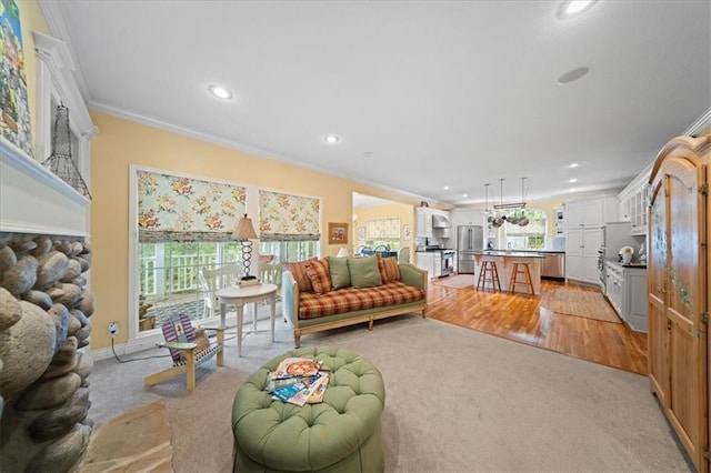 26266 W 110th Ter, Olathe, KS 66061 - living area featuring crown molding, recessed lighting, light carpet, and a fireplace