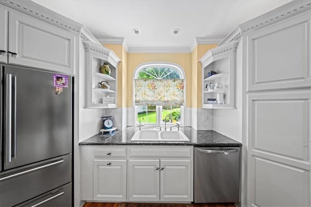 26266 W 110th Ter, Olathe, KS 66061 - kitchen with appliances with stainless steel finishes, open shelves, white cabinetry, ornamental molding, and backsplash