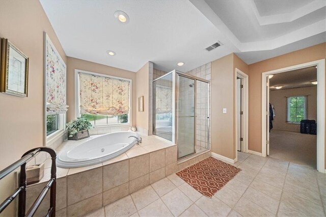 26266 W 110th Ter, Olathe, KS 66061 - full bath featuring a tub with jets, a stall shower, tile patterned floors, and recessed lighting