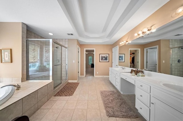 26266 W 110th Ter, Olathe, KS 66061 - bathroom featuring a shower stall, double vanity, a garden tub, tile patterned floors, and a spacious closet