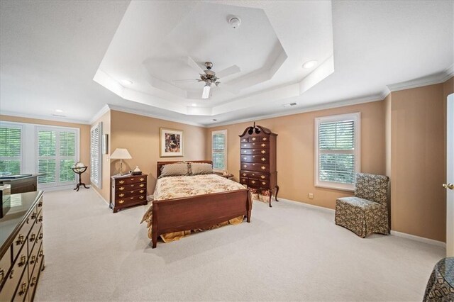 26266 W 110th Ter, Olathe, KS 66061 - bedroom featuring a tray ceiling, light colored carpet, crown molding, a ceiling fan, and recessed lighting