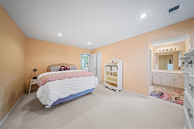 26266 W 110th Ter, Olathe, KS 66061 - bedroom featuring light carpet, connected bathroom, and recessed lighting