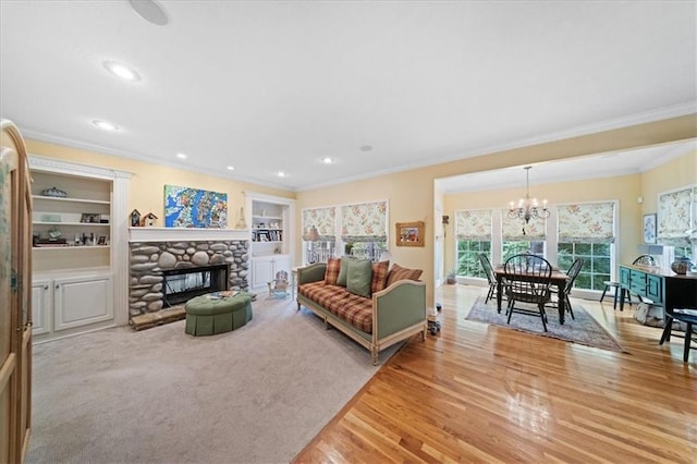 26266 W 110th Ter, Olathe, KS 66061 - living area with ornamental molding, a chandelier, a stone fireplace, light wood finished floors, and recessed lighting