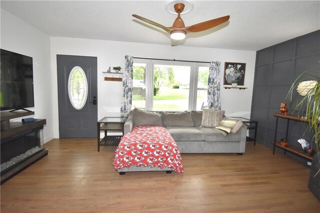 5233 N Garfield Ave, Kansas City, MO 64118 - living area with wood finished floors and ceiling fan