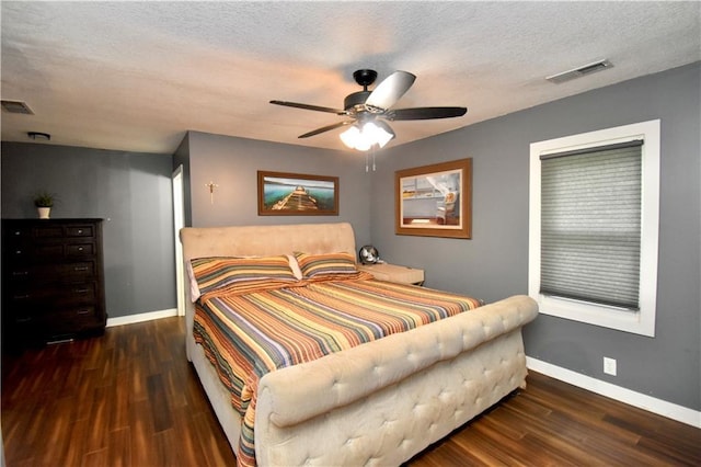 5233 N Garfield Ave, Kansas City, MO 64118 - bedroom with wood finished floors, baseboards, ceiling fan, and a textured ceiling