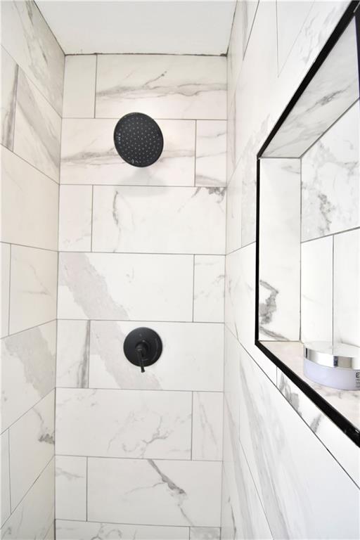 5233 N Garfield Ave, Kansas City, MO 64118 - full bath with a tile shower
