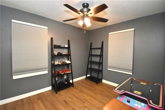 5233 N Garfield Ave, Kansas City, MO 64118 - misc room with a ceiling fan, wood finished floors, and baseboards