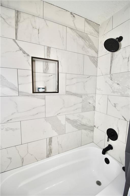 5233 N Garfield Ave, Kansas City, MO 64118 - bathroom with  shower combination