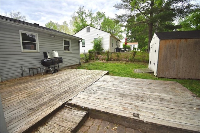 5233 N Garfield Ave, Kansas City, MO 64118 - deck with a storage shed, a fenced backyard, and an outdoor structure