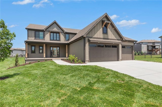 2314 SW Serena Pl, Lees Summit, MO 64082 - view of front of home with driveway, an attached garage, covered porch, and board and batten siding