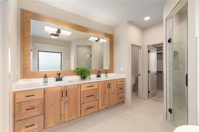 2314 SW Serena Pl, Lees Summit, MO 64082 - full bathroom with a shower stall, double vanity, tile patterned flooring, and recessed lighting