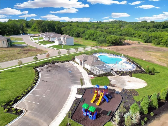 2314 SW Serena Pl, Lees Summit, MO 64082 - drone / aerial view of a pool and a heavily wooded area