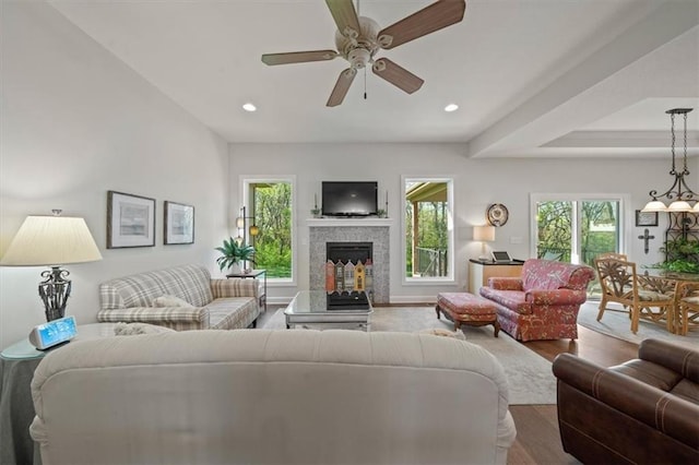 811 W Shawhan Pkwy, Lees Summit, MO 64086 - living room featuring ceiling fan, a wealth of natural light, a multi sided fireplace, and wood finished floors
