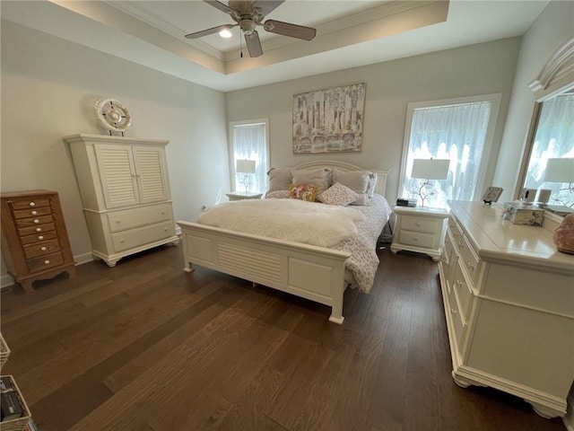 811 W Shawhan Pkwy, Lees Summit, MO 64086 - bedroom featuring a tray ceiling, dark wood-style flooring, crown molding, and a ceiling fan