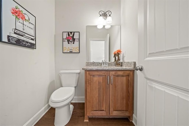 811 W Shawhan Pkwy, Lees Summit, MO 64086 - bathroom featuring baseboards, vanity, toilet, and wood finished floors