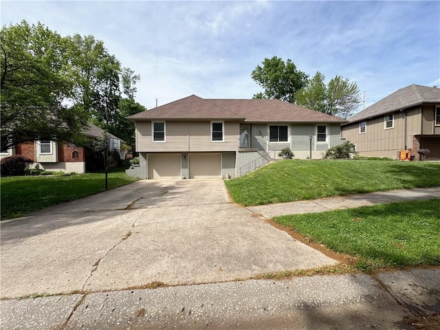 4024 NE 59th Ter, Gladstone, MO 64119 - view of front of home featuring concrete driveway, an attached garage, and a front yard