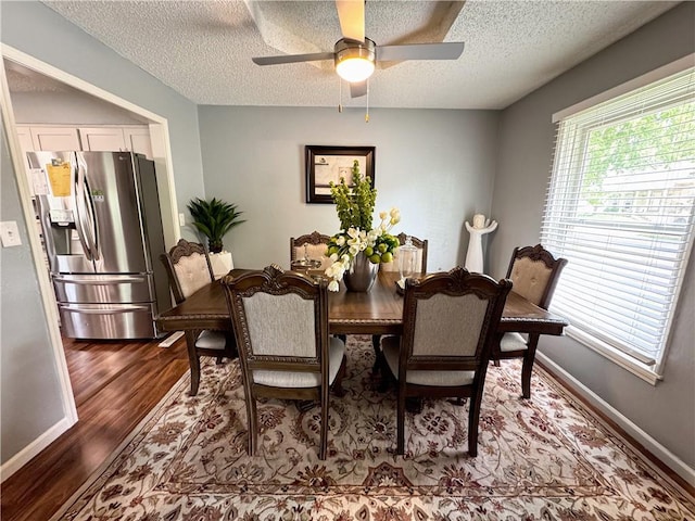 4024 NE 59th Ter, Gladstone, MO 64119 - dining room with baseboards, a ceiling fan, dark wood-style flooring, and a textured ceiling