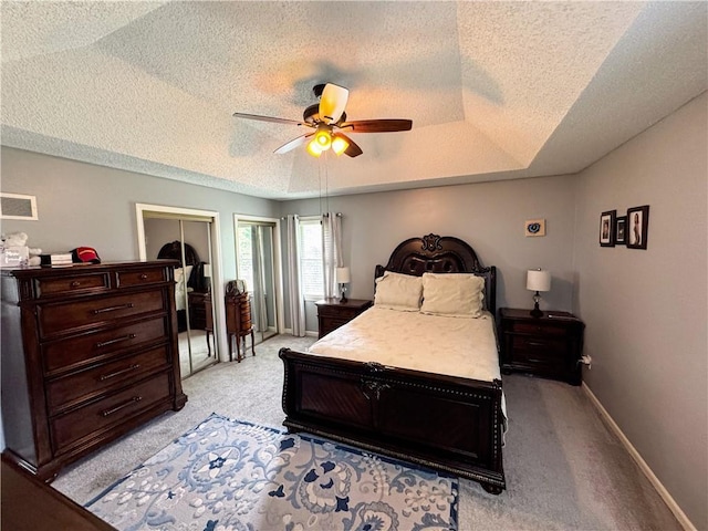 4024 NE 59th Ter, Gladstone, MO 64119 - bedroom featuring light colored carpet, a textured ceiling, a ceiling fan, baseboards, and visible vents