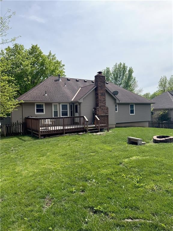 4024 NE 59th Ter, Gladstone, MO 64119 - back of house featuring a wooden deck, a chimney, a yard, and an outdoor fire pit