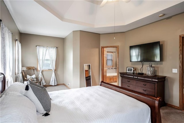 bedroom featuring baseboards, a ceiling fan, carpet, and ensuite bathroom