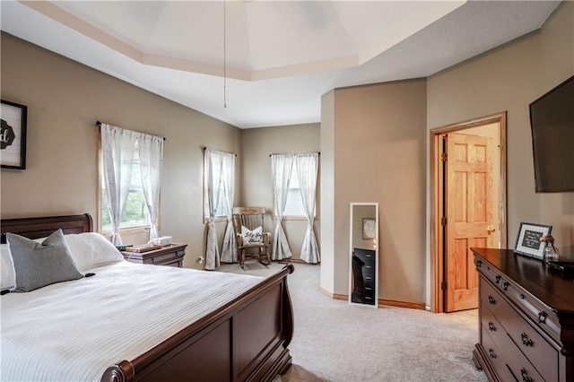 carpeted bedroom featuring baseboards