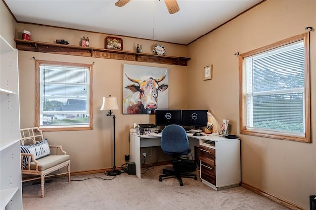 office area with a ceiling fan, light carpet, and a wealth of natural light