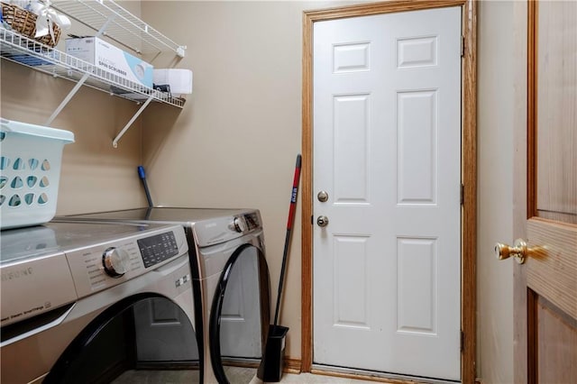 laundry area with laundry area and independent washer and dryer