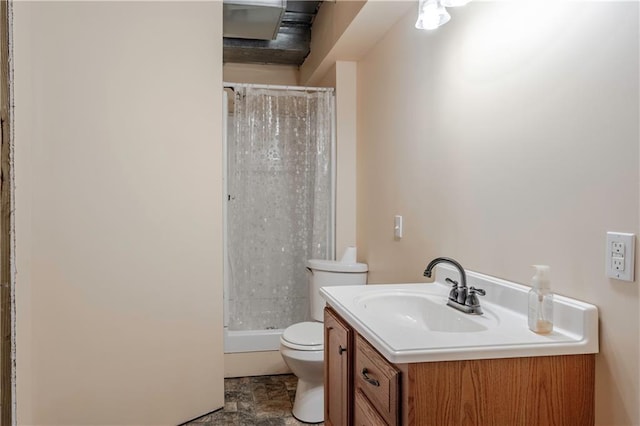 full bathroom with vanity, a stall shower, and toilet