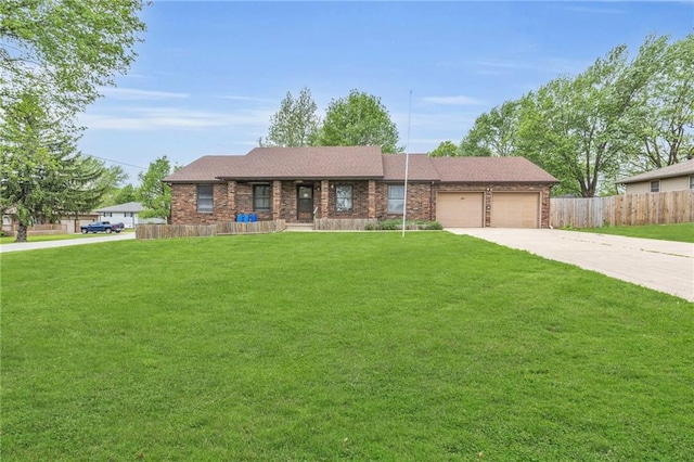 ranch-style home featuring fence, a front yard, brick siding, concrete driveway, and an attached garage